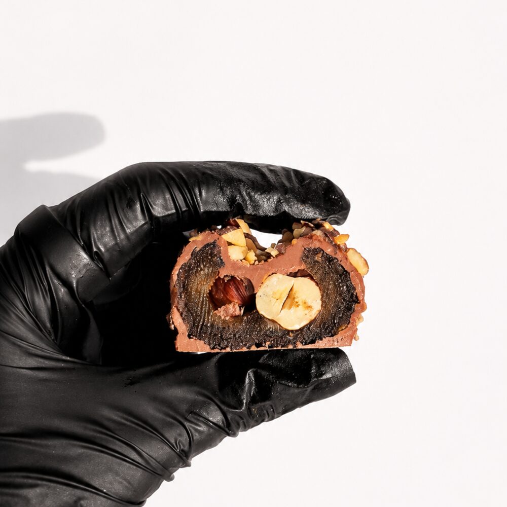 A BITEY protein chocolate in Belgian chocolate with a golden hazelnut crumb finish